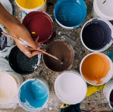 Several individual buckets of paint