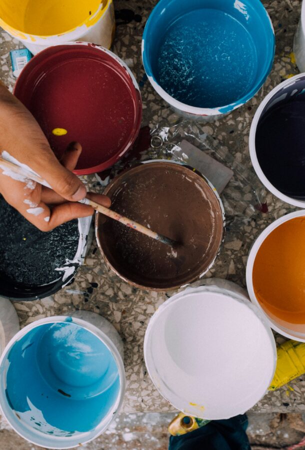 Several individual buckets of paint