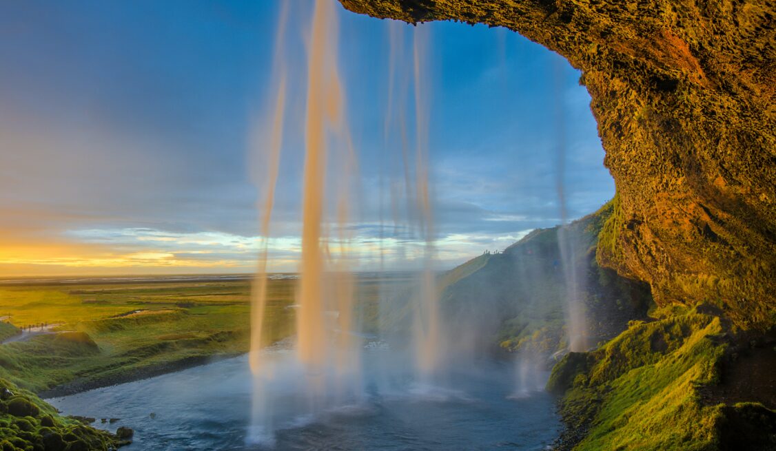 A colorful blue sky background and a waterfall