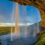 A colorful blue sky background and a waterfall