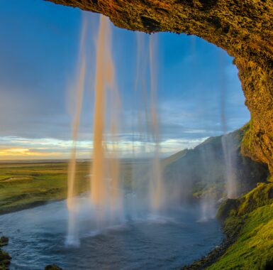 A colorful blue sky background and a waterfall