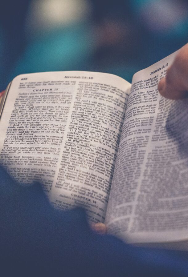 A follower flipping through the pages of the Bible