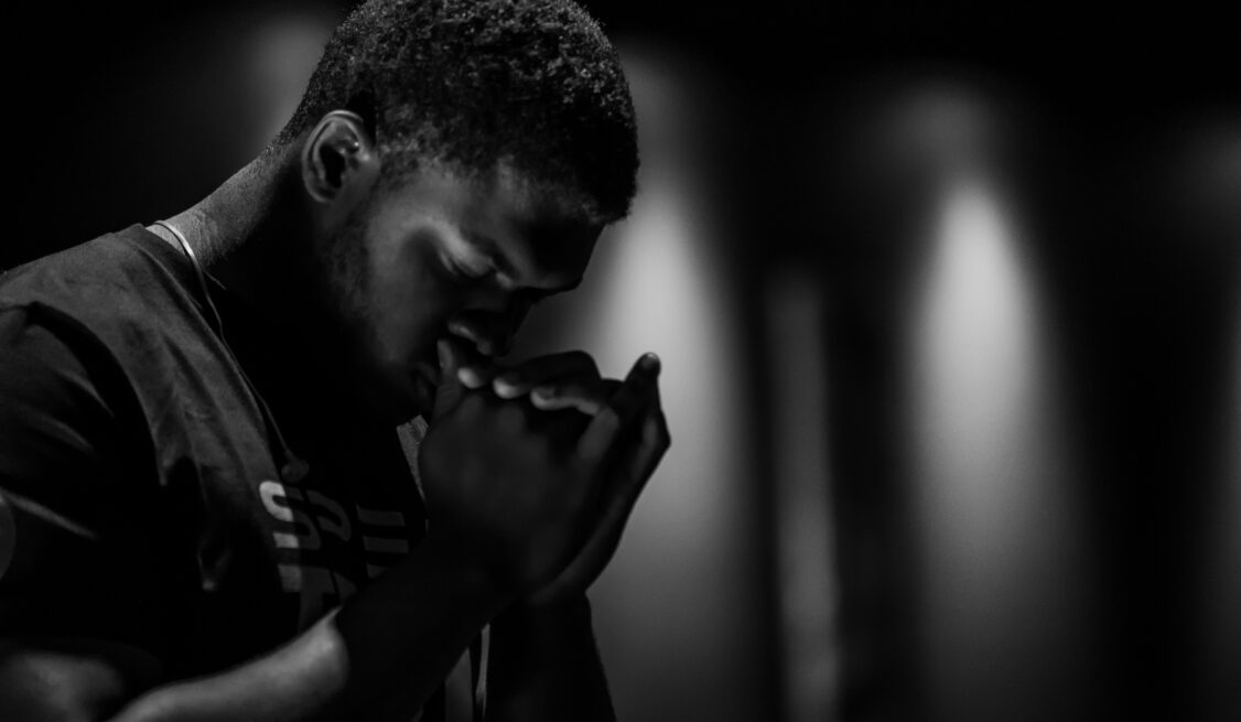 Black man praying