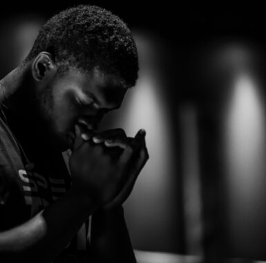 Black man praying
