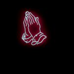 Neon light fixture of two hands praying