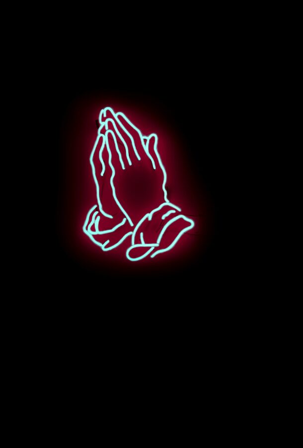 Neon light fixture of two hands praying
