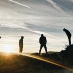 A group of young men embracing the light