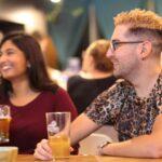 Man and woman drinking beer together