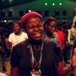 Young black woman praying sincerely